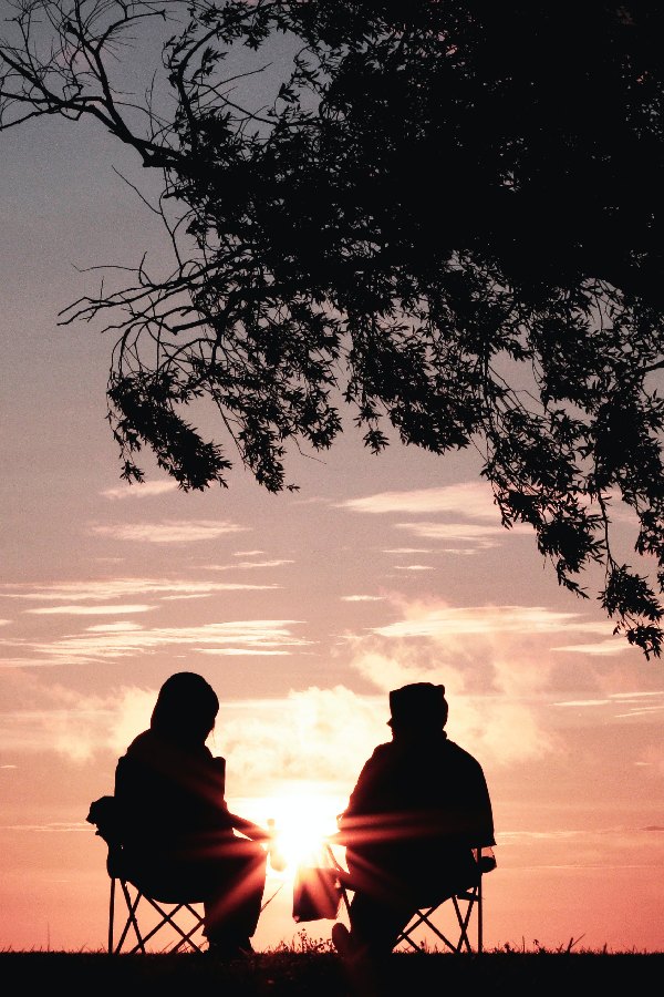 people sitting in sunset